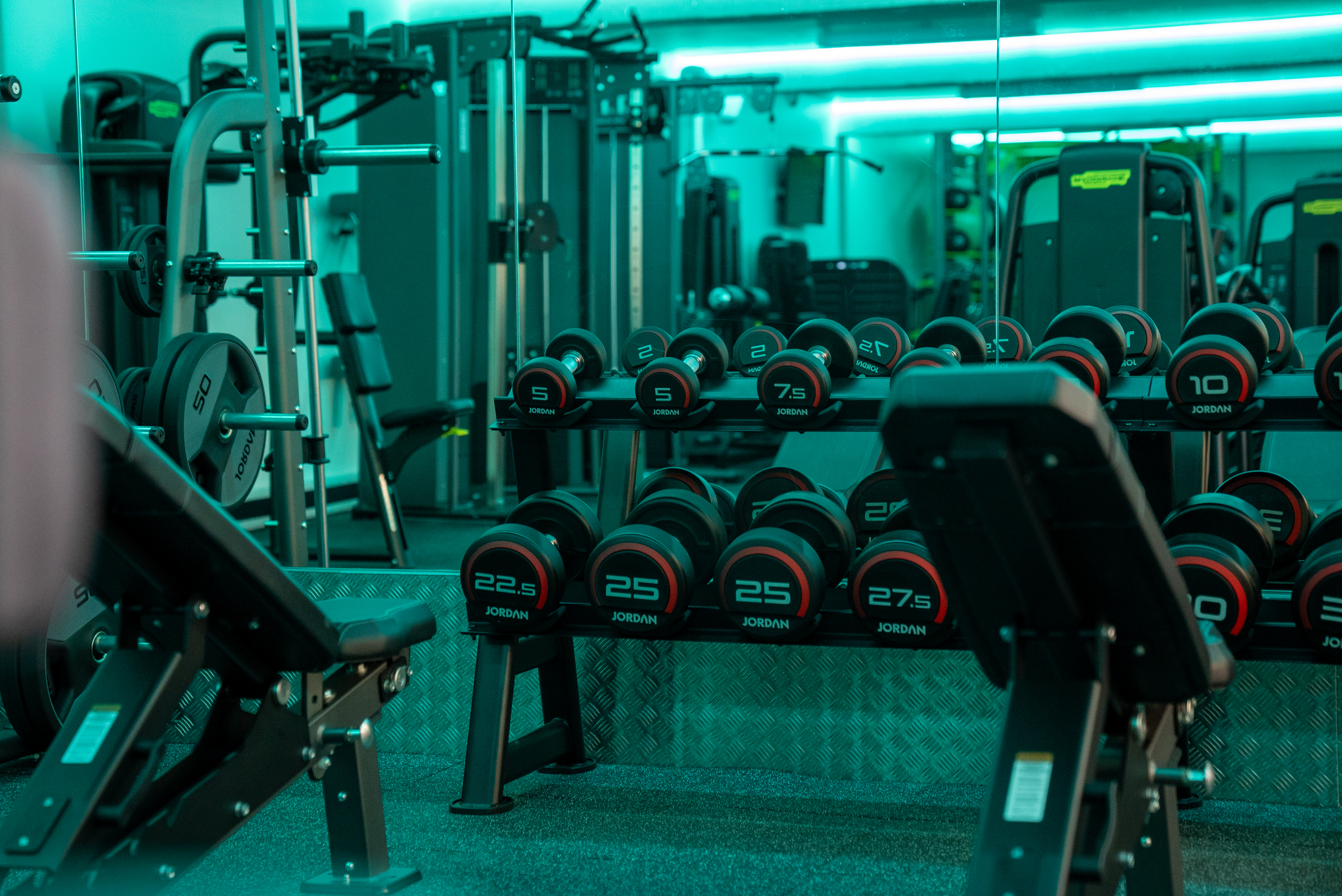 Gym at Dovedale Leisure Centre with benches and free weights