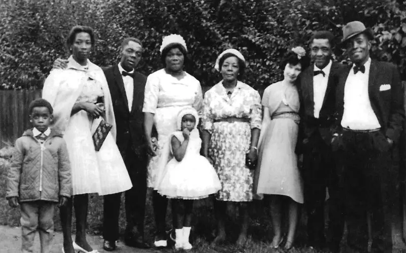 A black and white photo of a Caribbean family. 
