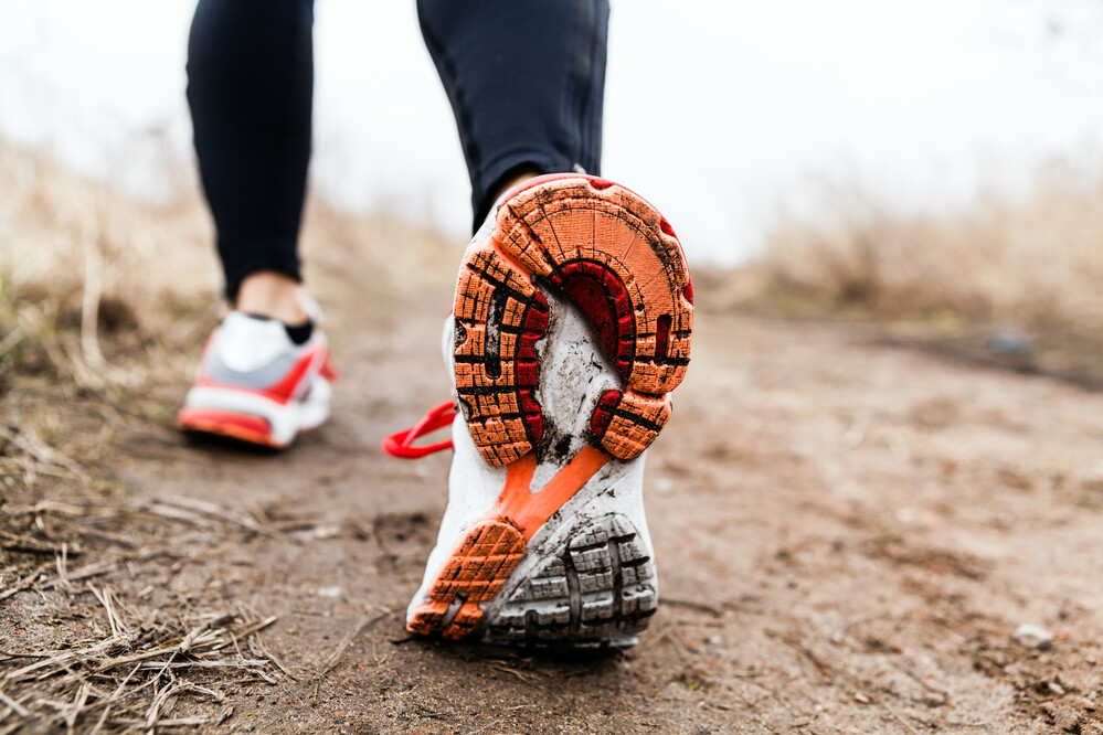 Trainers Walking Outside on muddy trail