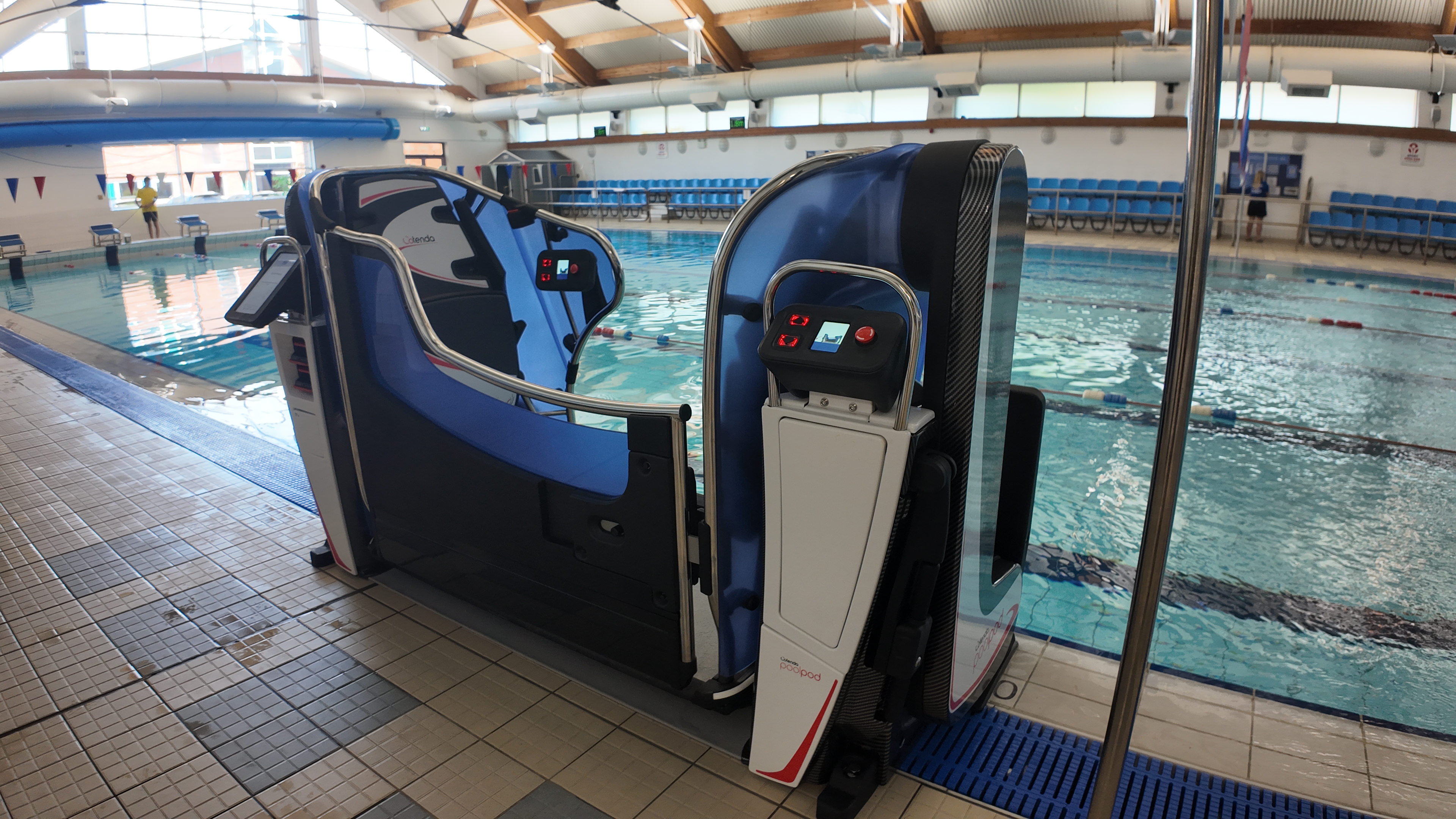 Large accessibility equipment to help people in wheelchairs access swimming pool