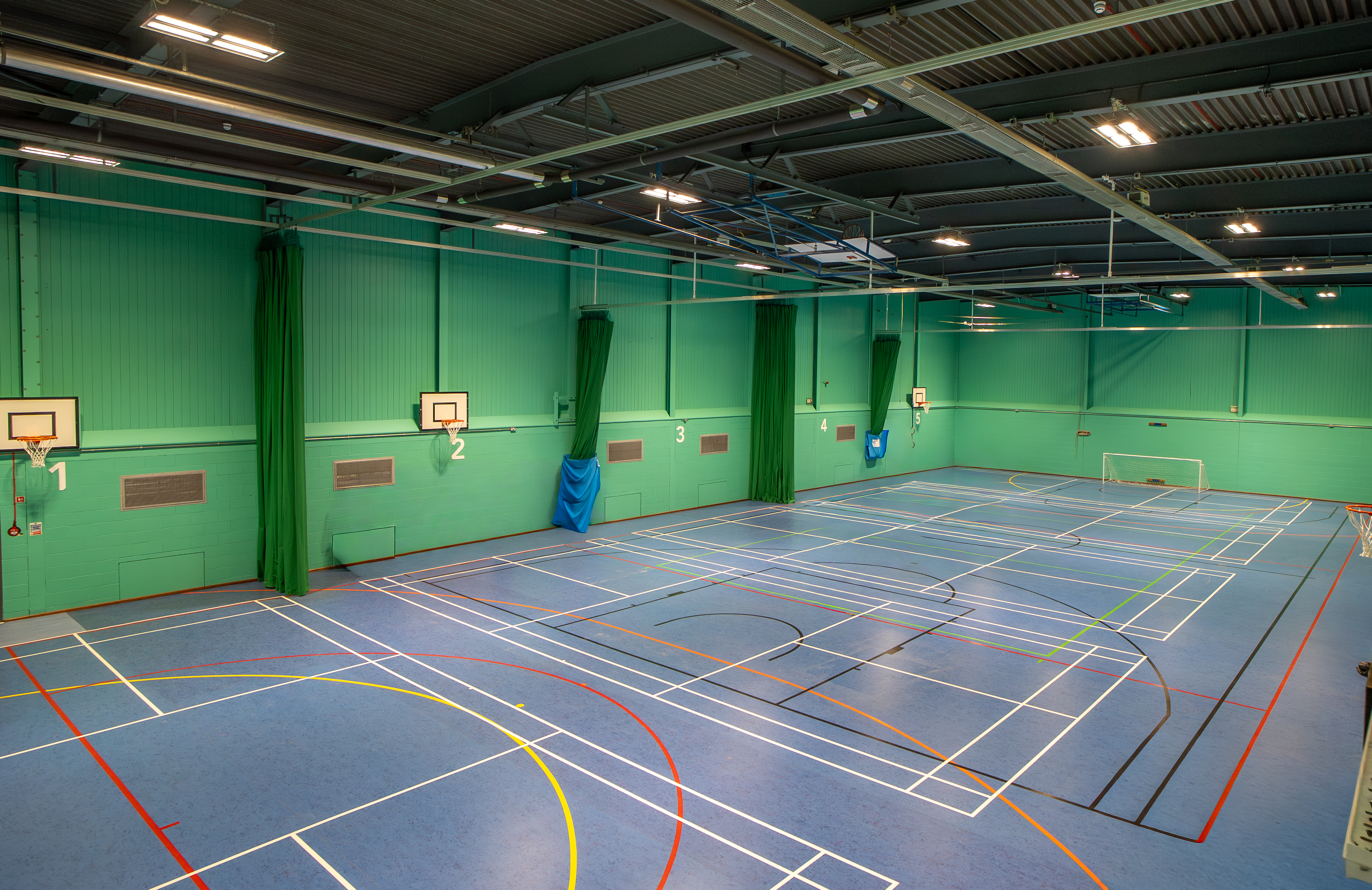 Sports hall at Dovedale Leisure Centre, with marking on floor for multiple types of sports