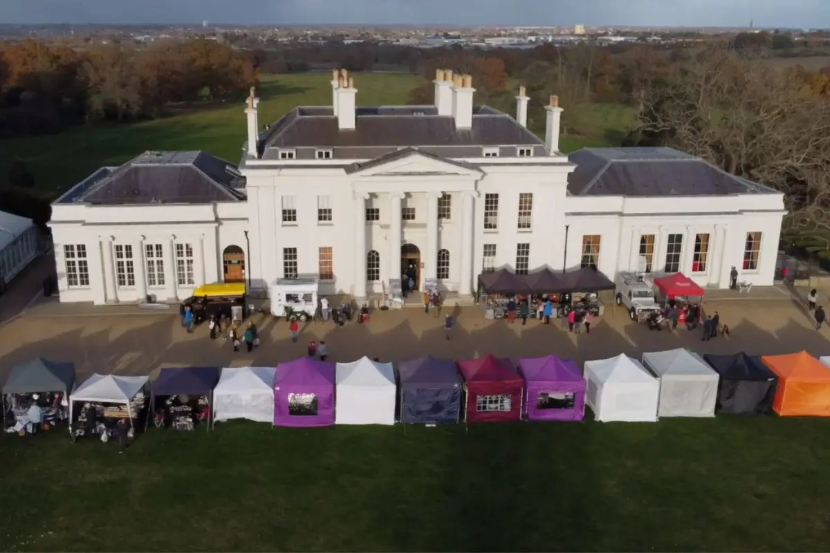 Hylands House with market stalls in front of the house