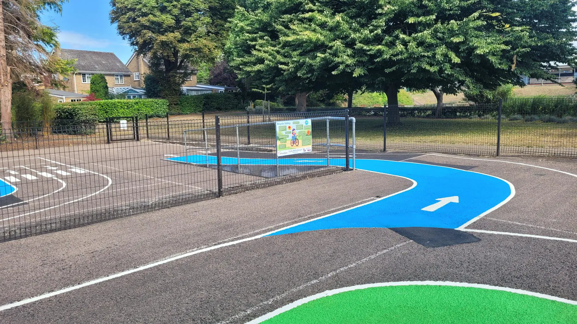View from top of blue ramp leading from one area of the Cycle Skills Circuit to the other