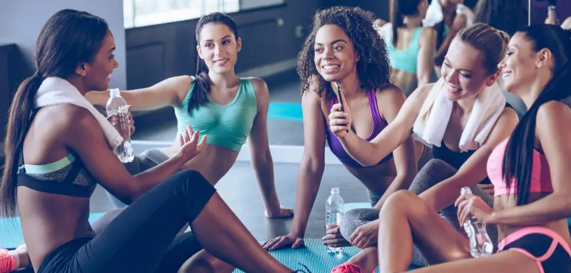 Group of women cooling down in exercise studio