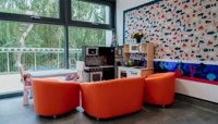 Kitchen play area with orange seating preview